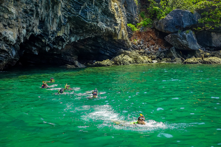 AO NANG, THAILAND - MARCH 05, 2018: Tourists relaxing and swimming in the turquoise water at chicken island in Thailandのeditorial素材