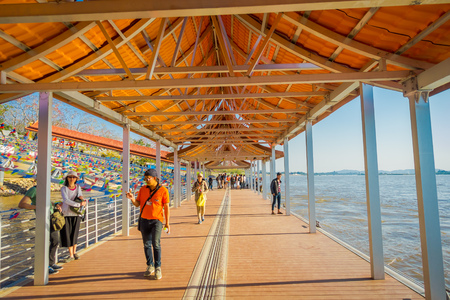 CHIANG RAI, THAILAND - FEBRUARY 01, 2018: Unidentified people walking inside of the pier at golden triangle Laosのeditorial素材