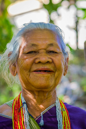 CHIANG RAI, THAILAND - FEBRUARY 01, 2018: Portrait of unidentified old woman walking in tropical rainforest in Chiang Mai Province, Thailandのeditorial素材