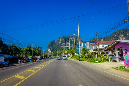 AO NANG, THAILAND - FEBRUARY 09, 2018: Outdoor view of the road to visit some tourists beaches, with some native buildings at one side at Ao Nang Townのeditorial素材