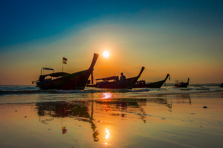 AO NANG, THAILAND - MARCH 05, 2018: Beautiful outdoor view of fishing thai boats during a sunset at Po-da island, Krabi Province, Andaman Sea, South of Thailandのeditorial素材