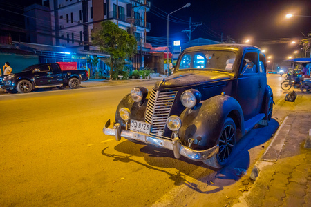 AO NANG, THAILAND - FEBRUARY 09, 2018: Outdoor view of old clasic black car parked in the streets during night in AO Nangのeditorial素材