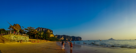 AO NANG, THAILAND - MARCH 05, 2018: Panoramic view of unidentified people walking in the beach with a mountain in the horizont, Andaman Sea, South of Thailandのeditorial素材