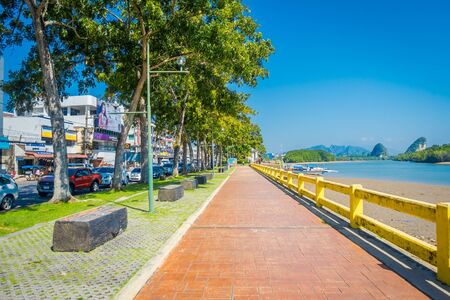 KRABI, THAILAND - FEBRUARY 19, 2018: Outdoor view of footpath between road and river in Krabi town, Thailand. Local people often walk relax and exercise in the morning in Krabiのeditorial素材
