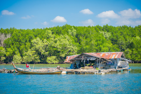 AO NANG, THAILAND - FEBRUARY 19, 2018: Outdoor view of very old and damaged house floating in the river close to the mangroves in Krabi Province, South of Thailandのeditorial素材