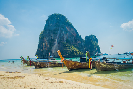 PHRA NANG, THAILAND - FEBRUARY 09, 2018: Outdoor view of long tail boats in a shore on Phra nang islandduring a sunny day and turquoise waterのeditorial素材