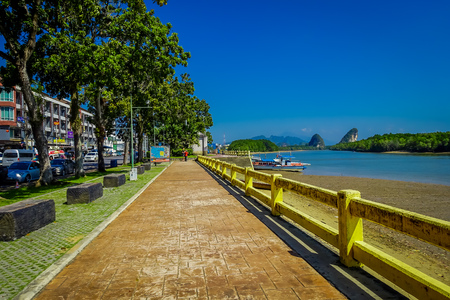 KRABI, THAILAND - FEBRUARY 19, 2018: Outdoor view of footpath between road and river in Krabi town, Thailand. Local people often walk relax and exercise in the morning in Krabiのeditorial素材