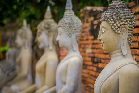 Close up of selective focus Ancient Buddha Statue at WAT YAI CHAI MONGKOL, The Historic City of Ayutthaya, Thailandの写真素材