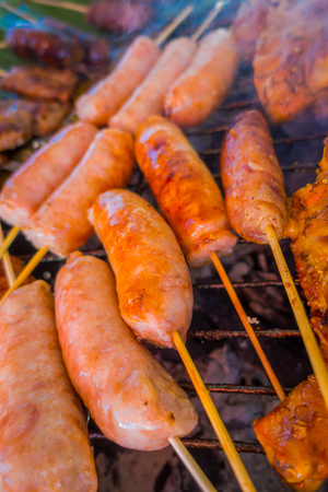 Close up of sausage brochette at street food in Chiang Mai in Thailandの写真素材