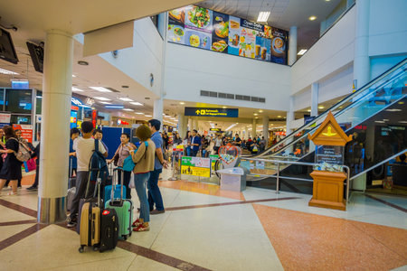 BANGKOK, THAILAND - FEBRUARY 01, 2018: Interior view of unidentified tourists inside of Bangkok International Airport with their lugagges, it is the main airport in Northern of Thailandのeditorial素材