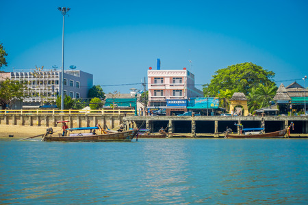 KRABI, THAILAND - FEBRUARY 19, 2018: Outdoor view of the shore of river with some boats in Krabi town, Thailand. Local people often walk relax and exercise in the morning in the borderのeditorial素材