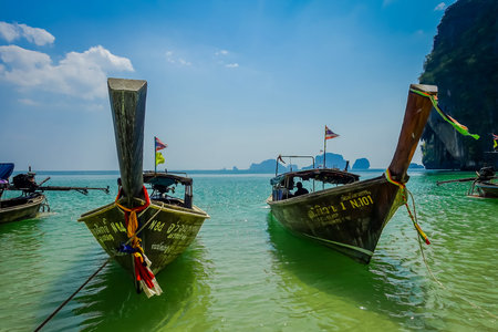 PHRA NANG, THAILAND - FEBRUARY 09, 2018: Long tail boats in a shore on Phra nang island in a gorgeous sunny day and turquoise waterのeditorial素材