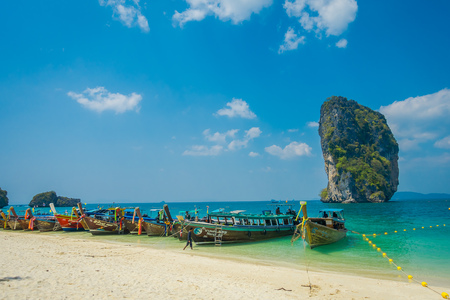 PODA, THAILAND - FEBRUARY 09, 2018: Beautiful outdoor view of long tail boats in a row at shore on Poda island in a gorgeous sunny day and turquoise waterのeditorial素材
