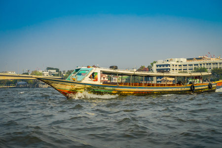 BANGKOK, THAILAND - FEBRUARY 09, 2018: Outdoor view of man sailing in a boat at yai canal or Khlong...
