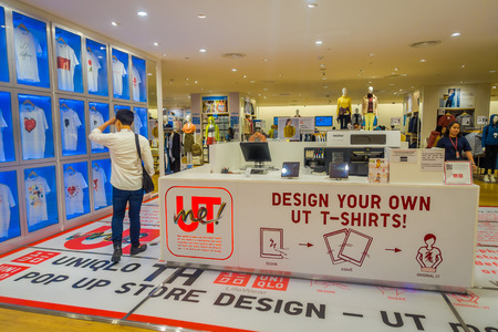BANGKOK, THAILAND, FEBRUARY 02, 2018: Indoor view of unidentified people inside of a store, with the option of design your own t-shirt in Siam mall centerのeditorial素材