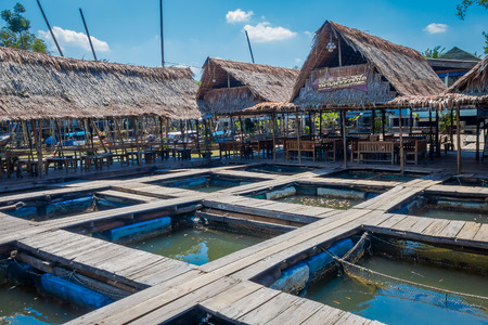 AO NANG, THAILAND - FEBRUARY 19, 2018: Outdoor view of traditional Thai seafood restaurant on stilts over the water in Krabi, Thailadのeditorial素材