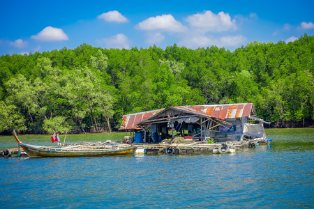 AO NANG, THAILAND - FEBRUARY 19, 2018: Outdoor view of very old and damaged house floating in the river close to the mangroves in Krabi Province, South of Thailandのeditorial素材