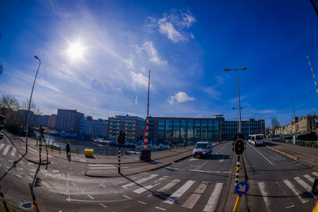 AMSTERDAM, NETHERLANDS, MARCH, 10 2018: Outdoor view of the streets close to the canals of Amsterdam, is the capital and most populous city of the Netherlands in beautiful sunny dayのeditorial素材