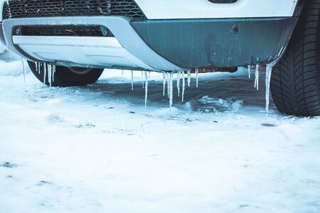 Close up of selective focus of car wheel over the snow in Norwayの写真素材