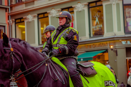 OSLO, NORWAY - MARCH, 26, 2018: Outdoor view of police woman on horse in the sreets of Oslo cityのeditorial素材
