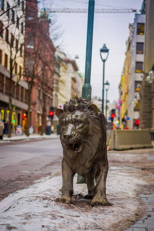 OSLO, NORWAY - MARCH, 26, 2018: Outdoor view of lion bronze statue in the streets of Osloのeditorial素材