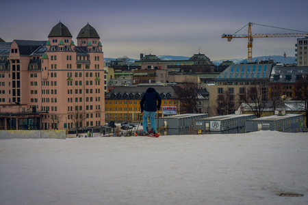 OSLO, NORWAY - MARCH, 26, 2018: Beautiful outdoor view of unidentified woman with skii clothes at Ski Jump building, located in Oslo, Norwayのeditorial素材