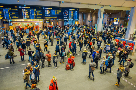 OSLO, NORWAY - MARCH, 26, 2018: Above view of crowd of people at Oslo Central Train Station, largest railway station in Oslo. There are 19 tracks for departure with modern technologyのeditorial素材