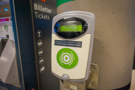 OSLO, NORWAY - MARCH, 26, 2018: Indoor view of machine, at Oslo Central Train Station, is the largest railway station in Oslo, close to a ticket machine, with modern technologyのeditorial素材