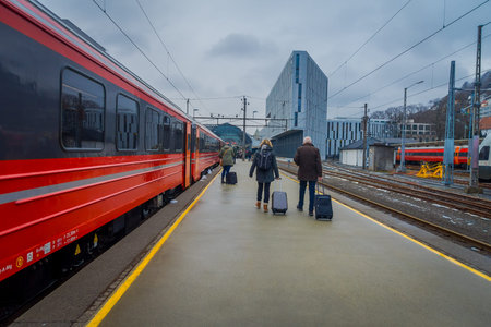 Bergen, Norway - April 03, 2018: Passengers leaving the train on the platform in the Bergen railway...