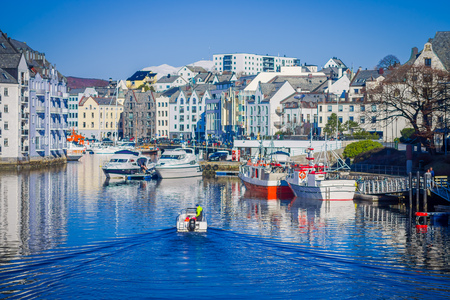 ALESUND, NORWAY - APRIL 04, 2018: Great summer view of Alesund port town on the west coast of Norway, at the entrance to the Geirangerfjord. Colorful morning cityscapeのeditorial素材