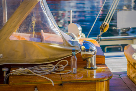 ALESUND, NORWAY - APRIL 04, 2018: Outdoor view of ropes with a glass of bottle in the boat in port of Alesund in Norwayのeditorial素材