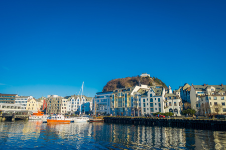 ALESUND, NORWAY - APRIL 04, 2018: Beautiful summer view of Alesund port town on the west coast of Norway, at the entrance to the Geirangerfjordのeditorial素材