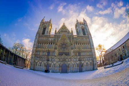 TRONDHEIM, NORWAY - APRIL 06, 2018: Nidaros ancient gothic cathedral front view from city central square, Nidarosdomenのeditorial素材