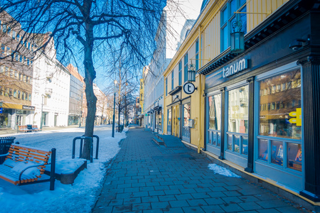 TRONDHEIM, NORWAY - APRIL 04, 2018: Outdoor view of the empty streets with traditional Scandinavian buildings stand along in Trondheimのeditorial素材