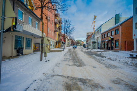 Bodo, Norway - April 09, 2018: Outdoor view of empty the streets of Bodo, during winter covered with snow the sidewalkのeditorial素材