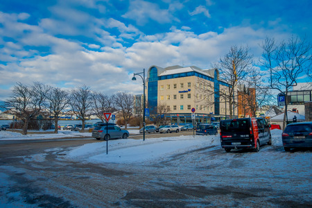 Bodo, Norway - April 09, 2018: Beautiful view of streets with snow during winter with unidentified peole walking in the streets of Bodo, in Norwayのeditorial素材
