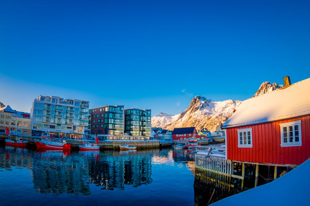 SVOLVAER, LOFOTEN ISLANDS, NORWAY - APRIL 10, 2018: Gorgeous view of Svolvaer village with many boats in the port of the city in the Lofoten Islandsのeditorial素材