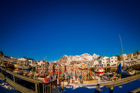 LOFOTEN, NORWAY, APRIL, 10, 2018: Scenic view of the waterfront harbor in Henningsvaer in winter, is a fishing village and tourist town located on Austvagoya in the Lofoten Islandsのeditorial素材