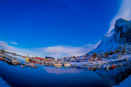 SVOLVAER, LOFOTEN ISLANDS, NORWAY APRIL 09, 2018: Outdoor view of some boats in the harbor with buildings behind in Svolvaer, in March International cod fishing competitionのeditorial素材
