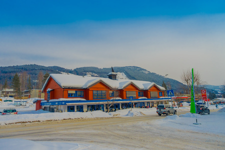 GOL, NORWAR, APRIL, 02, 2018: Winter outdoor view of red wooden buildings located in dowtown covered with snow during a winter in the city of GOLのeditorial素材