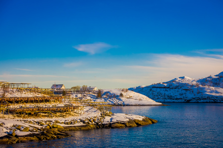 Henningsvaer, Norway - April 09, 2018: Above view of wooden buildings and fishing boats in the port of Henningsvaer in Lofoten islandsのeditorial素材
