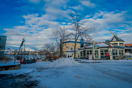 Bodo, Norway - April 09, 2018: Beautiful view of streets with snow during winter with unidentified peole walking in the streets of Bodo, in Norwayのeditorial素材