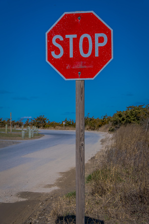 LONG ISLAND, USA, APRIL, 04, 2018: Outdoor view of informative sign of STOP, located at one side of the road in the beach at Long islandのeditorial素材