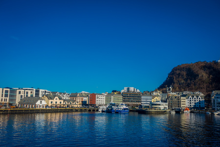 ALESUND, NORWAY - APRIL 04, 2018: Summer view of Alesund port town on the west coast of Norway, at the entrance to the Geirangerfjord, traveling concept backgroundのeditorial素材