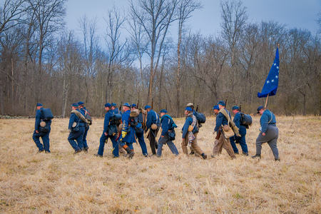 MOORPARK, USA - APRIL, 18, 2018: Unidentified people wearing blue uniform, holding a flag and representing the Civil War Reenactment in Moorpark, the largest battle reenactmentのeditorial素材