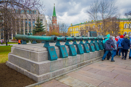 MOSCOW, RUSSIA- APRIL, 24, 2018: People walking close to old military trunks of ancient cannons. Collection incorporates old Russian and foreign cannons of XVI-XIX centuries shown in the Moscow Kremlinのeditorial素材