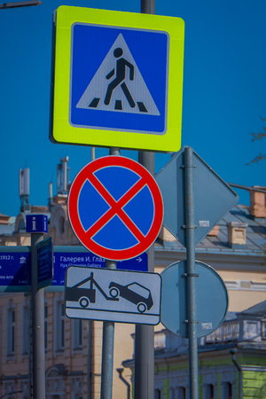 MOSCOW, RUSSIA- APRIL, 24, 2018: Informative signs of people have to use , pedestrian crossing, to cross the street, and not parking area over metallic structureのeditorial素材