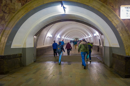 MOSCOW, RUSSIA- APRIL, 24, 2018: Indoor view of people walking around Metro Station in rush hour, with some white light lampsのeditorial素材