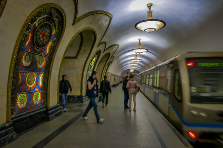 MOSCOW, RUSSIA- APRIL, 29, 2018: People in front of train in Novoslobodskaya subway station, the station is on the Koltsevaya Line of the Moscow Metro and opened in 1952 in Moscow, Russiaのeditorial素材