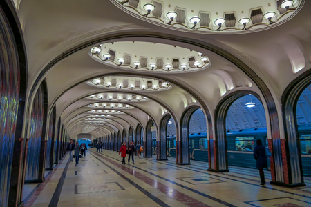 MOSCOW, RUSSIA- APRIL, 29, 2018: People walking inside of Mayakovskaya subway station in Moscow, Russia, Stalinist architecture, one of the most famous Metro stations in the world. Opened in 1938のeditorial素材